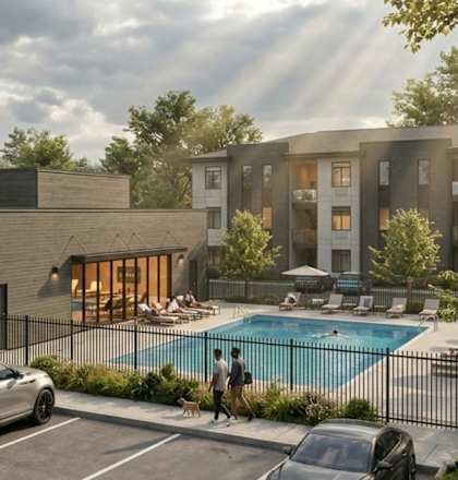 A modern building with a pool in front of it.