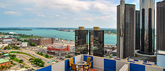 a balcony with a view of the city