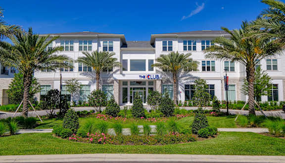 a building with palm trees in front of it