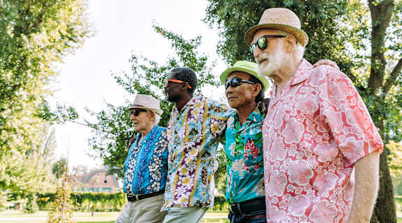 a group of men standing in a park
