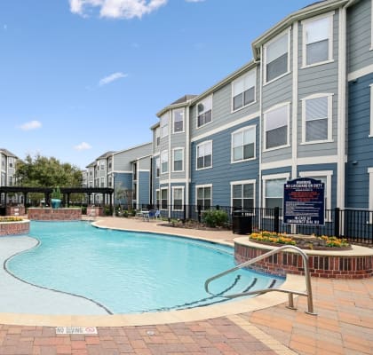 Park North Apartments in Houston, Texas Exterior and Pool with Lounge Chairs