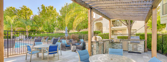 the reserve at bucklin hill leasing office patio with grill and seating area