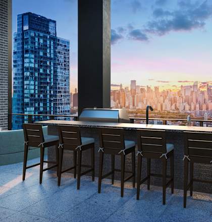 A modern bar with a view of the city skyline at dusk.