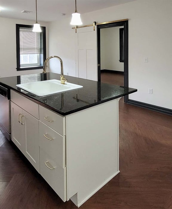 a kitchen with a counter top and a sink