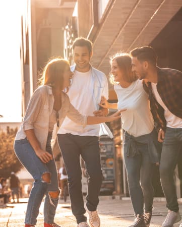 Group of Friends Walking Together Laughing
