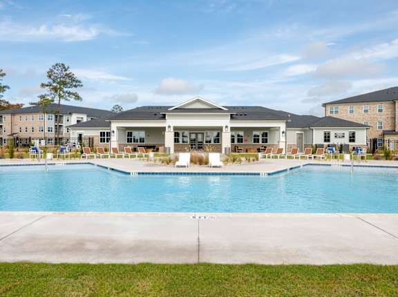 The Tides of Shallotte Apartments in Shallotte, North Carolina Pool with Lounge Chairs