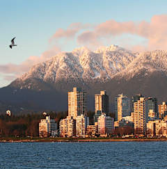 a view of the city of vancouver with mountains in the background