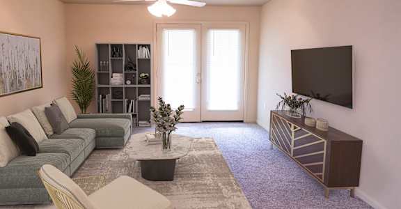 a living room with pink walls and a gray couch