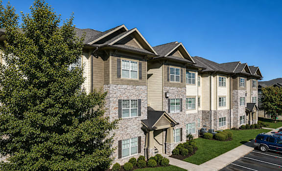 A row of apartment buildings with a clear blue sky above.