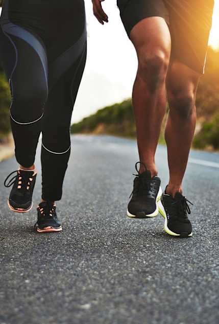 Two People Running on Path Together