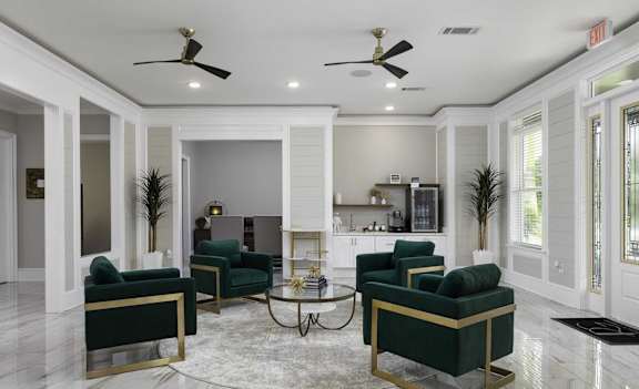 A living room with a white ceiling and a fireplace.