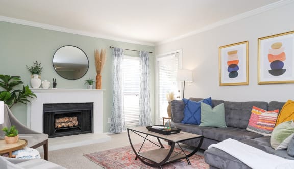 a living room with a couch and a fireplace
