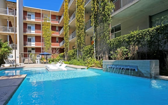 a large swimming pool in front of an apartment building  at 1221 Broadway Lofts, San Antonio, 78215