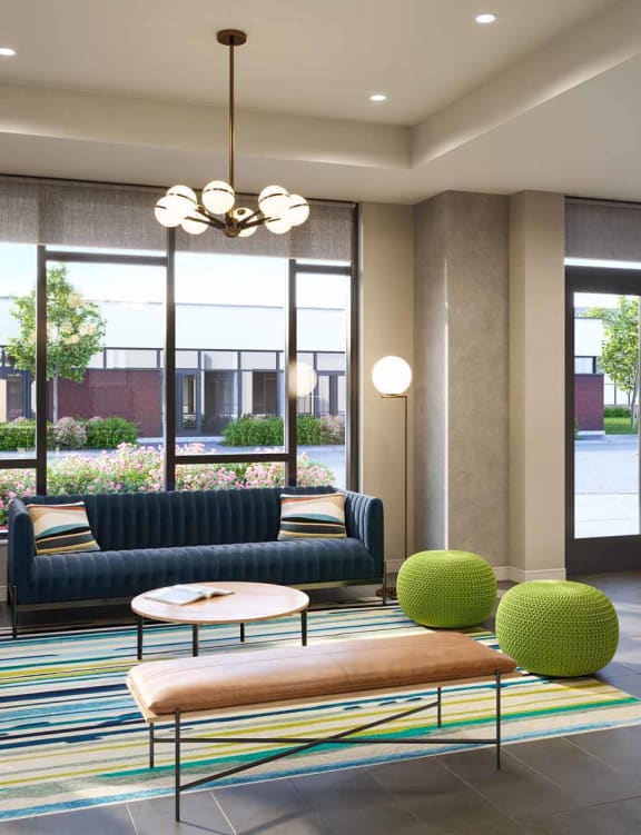 a living area with a couch coffee table and a kitchen with an island