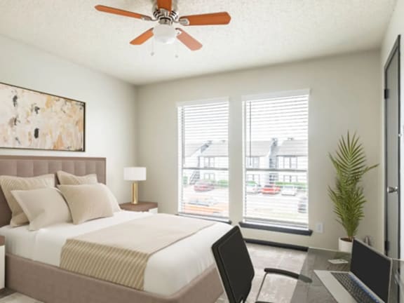 a bedroom with a large bed and a ceiling fan