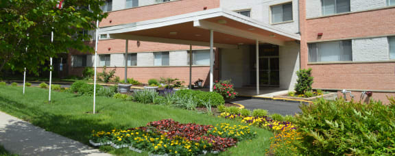 a garden with a picnic table and a bench