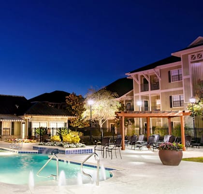 A large house with a pool in the backyard.