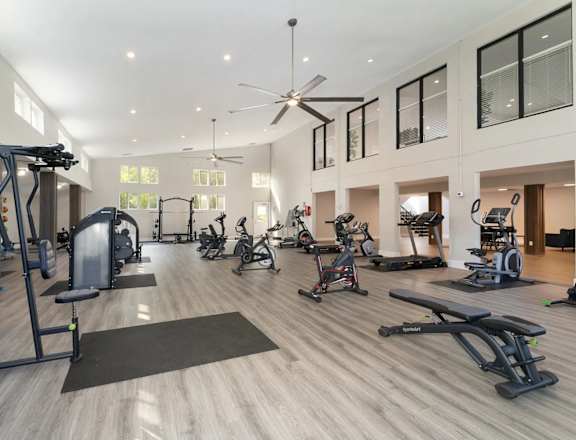 the gym in the owners suite has treadmills and other exercise equipment  at Village 1373, Greensboro, NC 27455