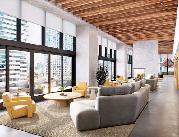 A modern living room with a long couch and a coffee table.