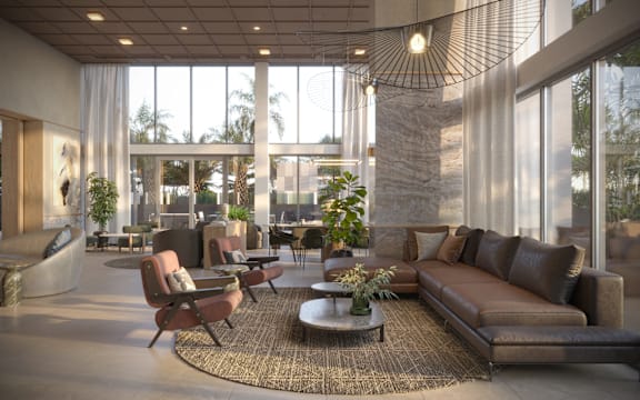 A modern living room with brown leather sofas and a large window.