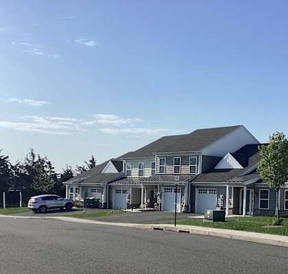 a large house with a street in front of it