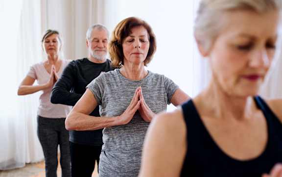a group of people doing yoga