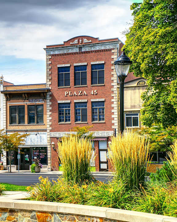 A street view of a plaza with a building that says Plaza 45.