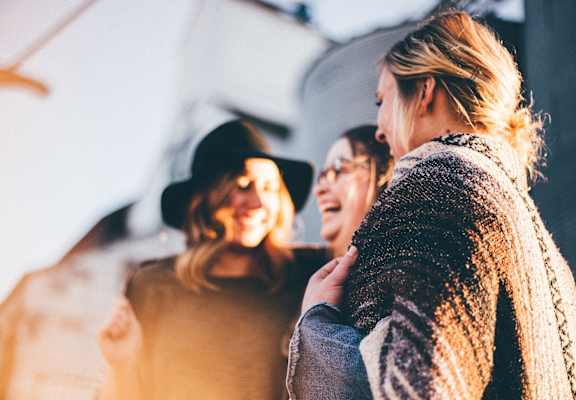 Three women laughing