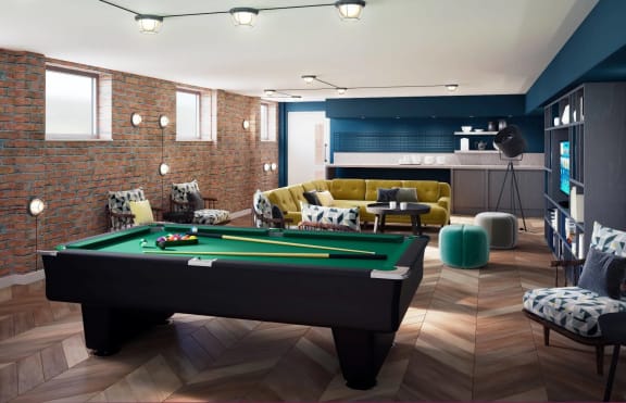 a games room with a pool table and a television