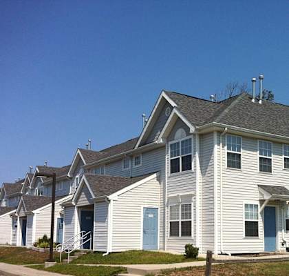 a large white house with a gray roof