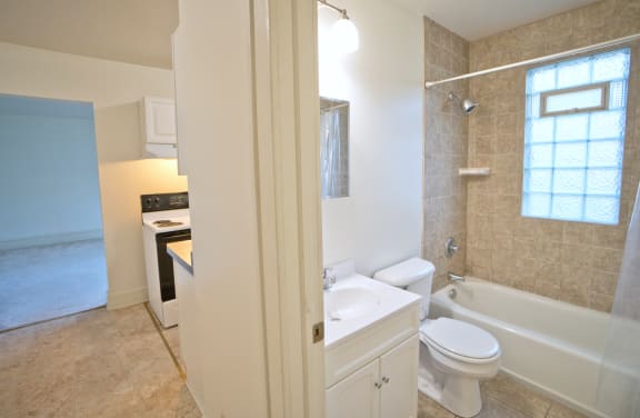 a bathroom with a sink toilet and bathtub