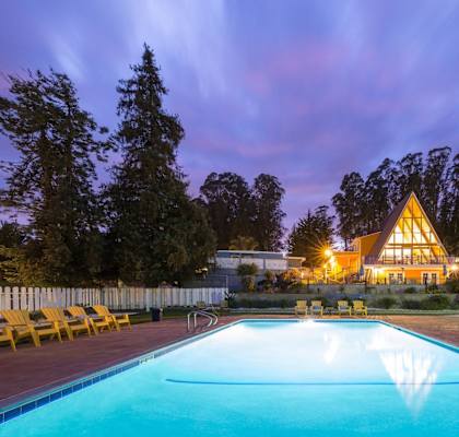 pool view with the main cabin in the background at Salinas Sunset Apartments, Salinas, CA, 93907