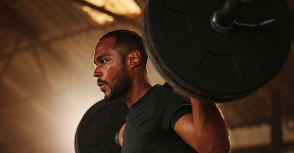 Man Working Out in Gym
