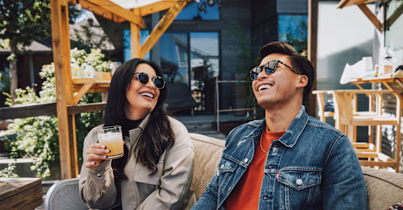 Friends Having Drinks Together Smiling