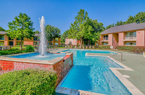 Resort-style pool with fountain at Creekside at Pear Ridge Apartments, Texas, 75287