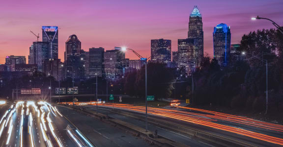 Downtown Charlotte, North Carolina Skyline and Freeway at Dusk