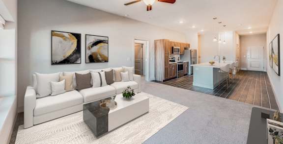 A modern living room with a white sofa and a coffee table.