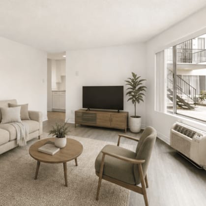 A living room with a couch, chair, and television.