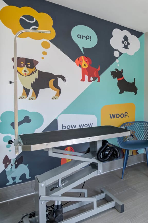 Dog grooming station with a table and chairs and pictures on the wall La Mesa, California, 91942