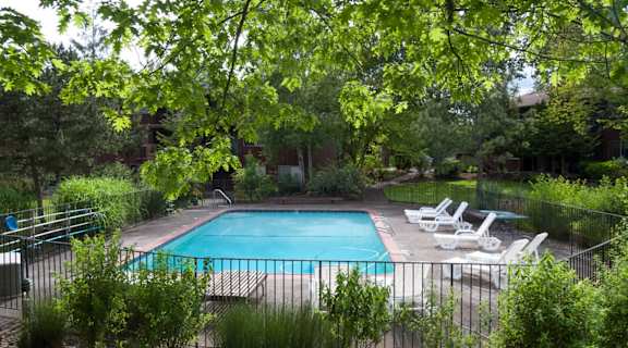 Royal Oaks Apartments Pool with Lounge Chairs