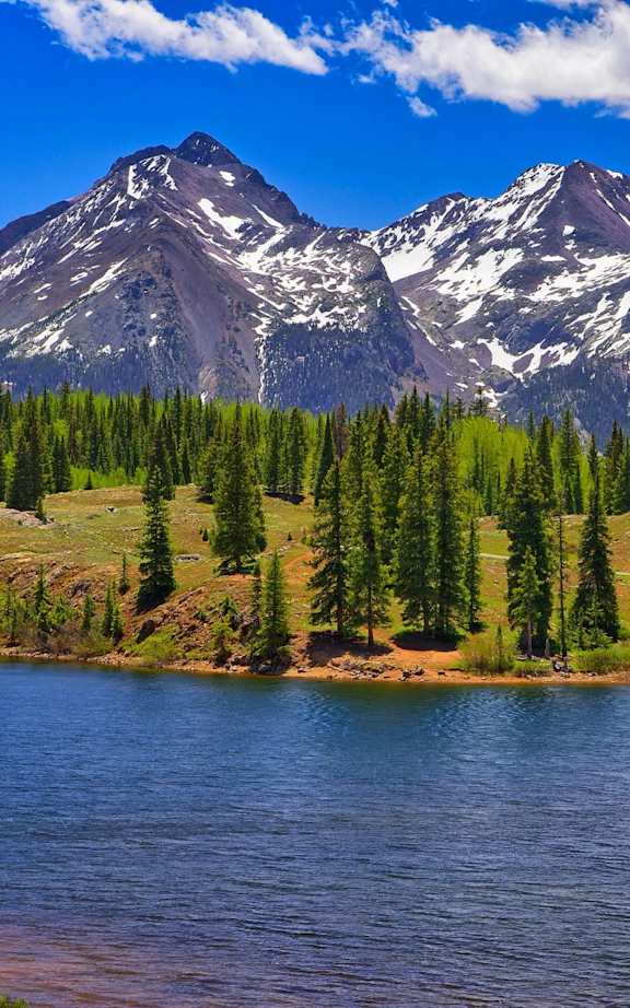 A small town with a mountain in the background.