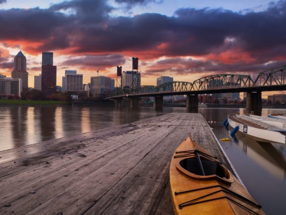 Canoe on Dock with View of Downtown Portland, OR