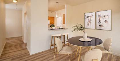 A dining room with a table and chairs. at Fairview Village Apartments, Fairview, OR, 97024