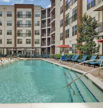 Alton Optimist Park Apartments in Charlotte, North Carolina Exterior and Pool with Lounge Chairs