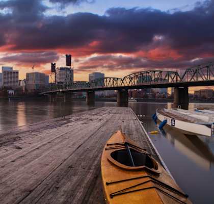 Wooden Dock with a Canoe and Portland Skyline in the Background