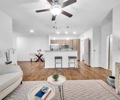 Open-concept living room and kitchen at Fox Hunt Farms apartments in Fort Mill, SC