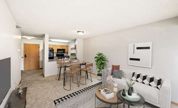 a living room with a couch a table and a chair