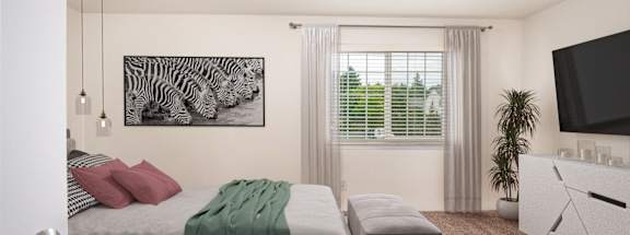 A bedroom with a bed, a couch, a television, and a zebra print picture on the wall.at Vancouver Mall Apartments, Vancouver, WA 98662