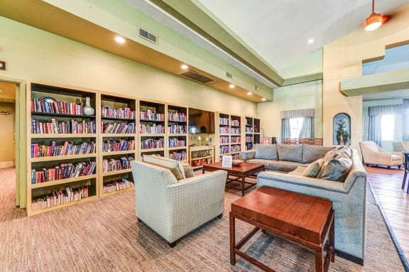 Community library sitting area at Country Club at The Meadows Senior Apartments in Las Vegas, NV, For Rent. Now leasing 1 and 2 bedroom apartments.