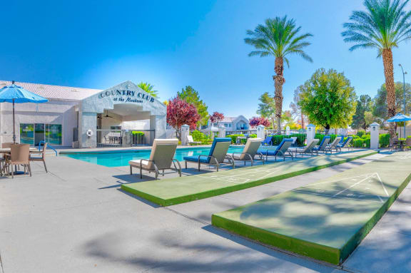 Shuffleboard poolside at Country Club at The Meadows Senior Apartments in Las Vegas, NV, For Rent. Now leasing 1 and 2 bedroom apartments.